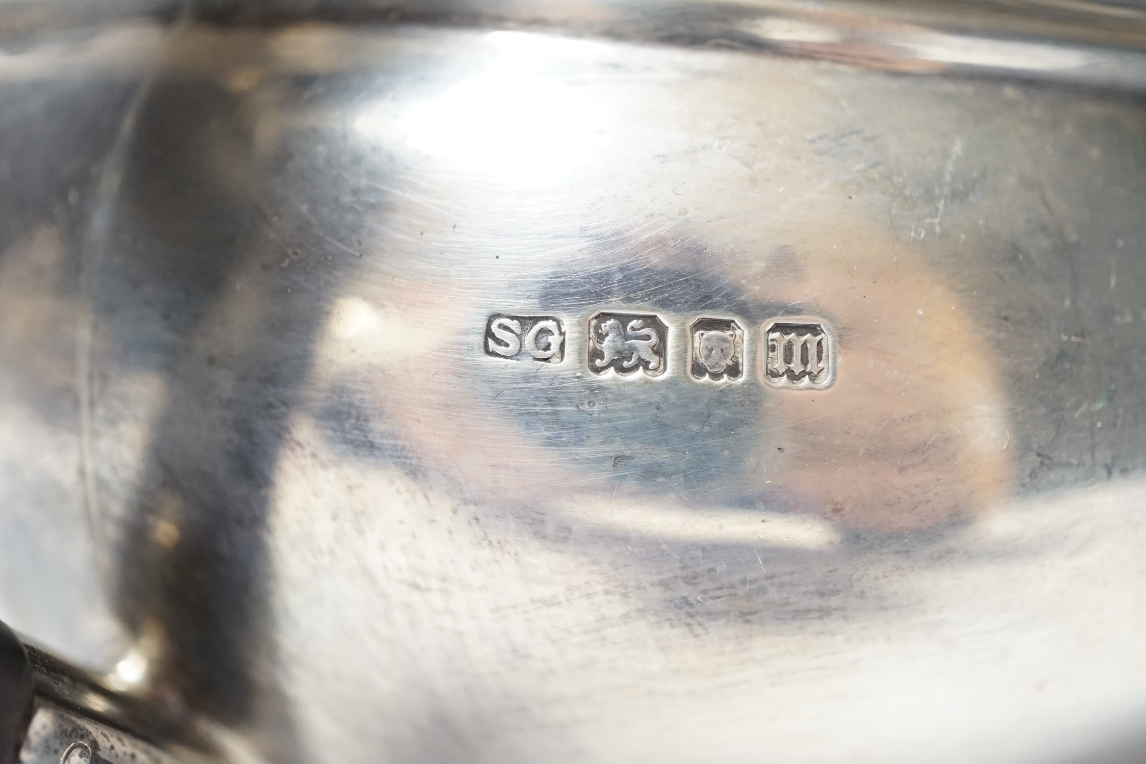 A George V silver teapot by Sebastian Garrard, London, 1927, gross weight 20.9oz.